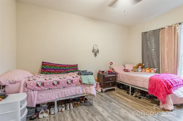 a bedroom with a bed and a table