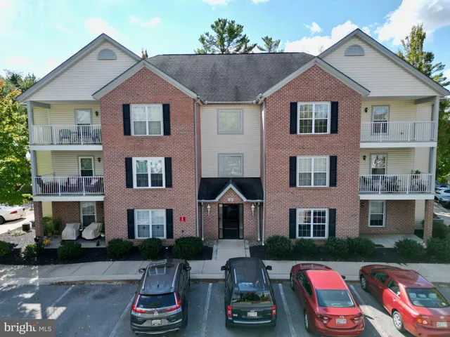 a view of a house with a tree