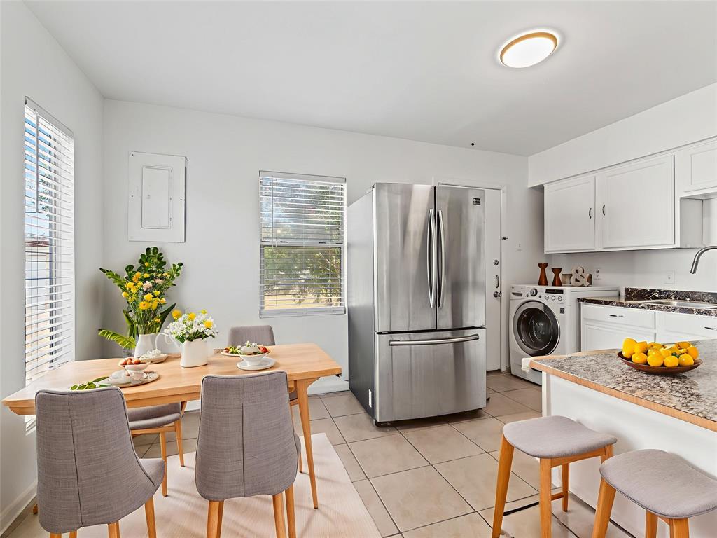 826 Ryan Road Dallas, TX 75224 - Photo 11 of 34 a kitchen with refrigerator and cabinets