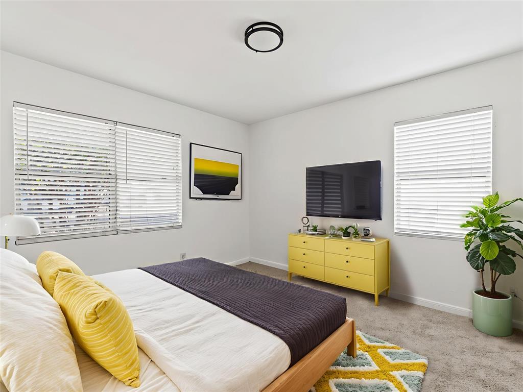 826 Ryan Road Dallas, TX 75224 - Photo 19 of 34 a bedroom with a bed and a television