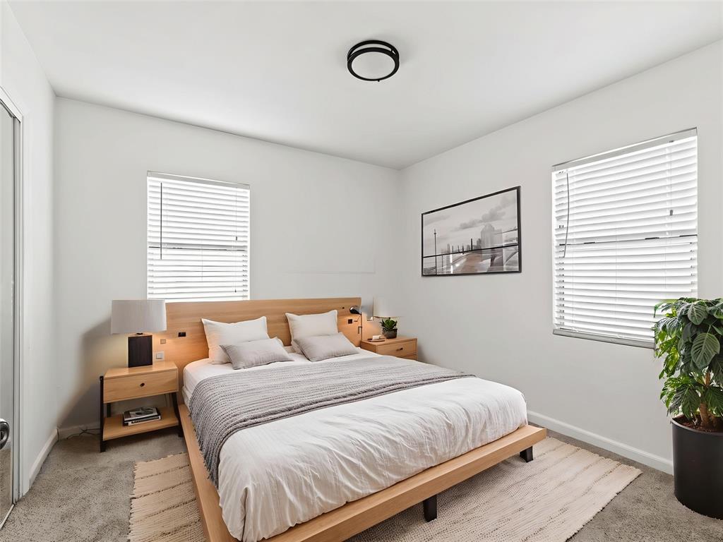 826 Ryan Road Dallas, TX 75224 - Photo 22 of 34 a bedroom with a bed and a window