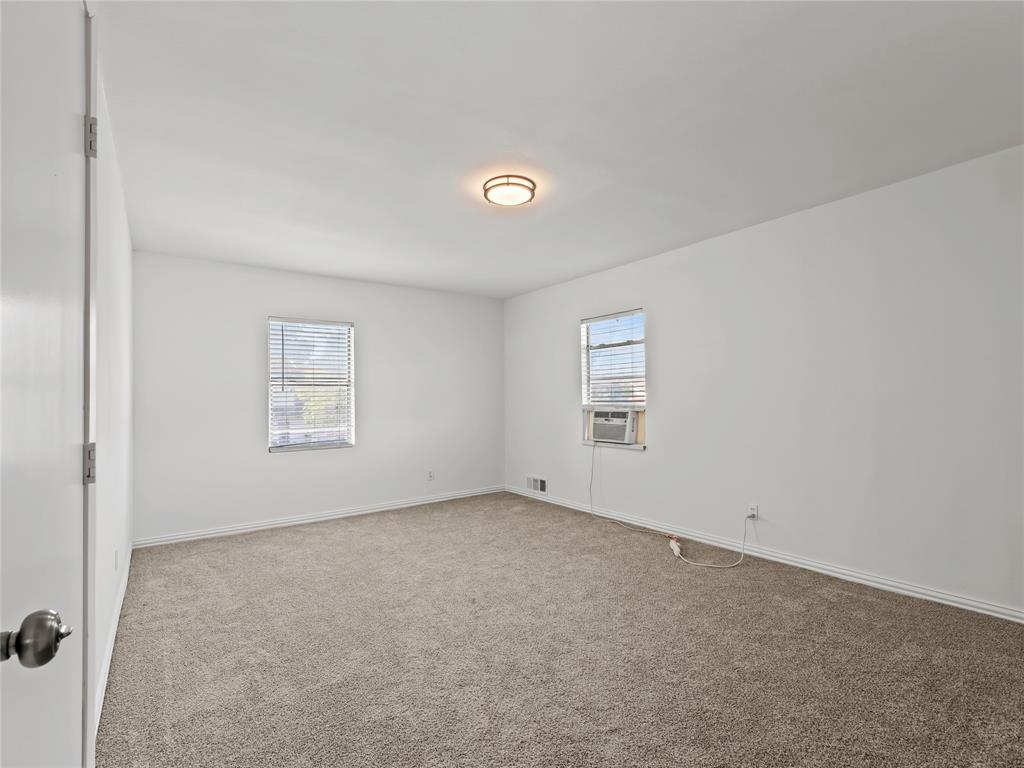 826 Ryan Road Dallas, TX 75224 - Photo 25 of 34 an empty room with a window