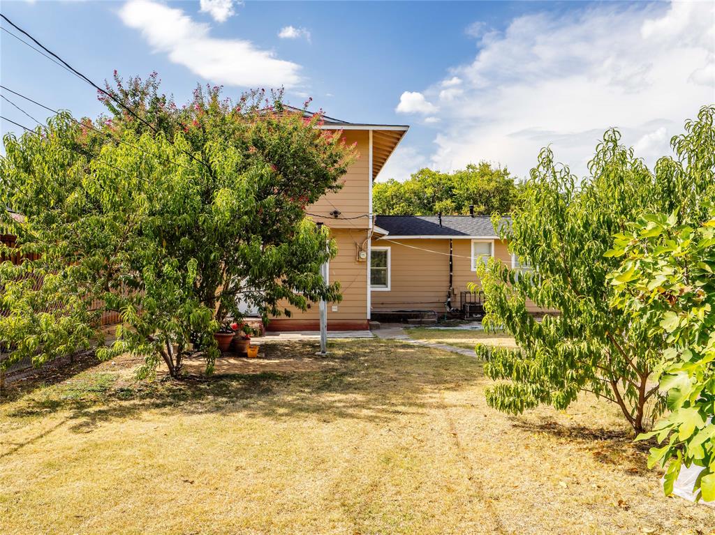 826 Ryan Road Dallas, TX 75224 - Photo 30 of 34 a view of a house with a yard and garage