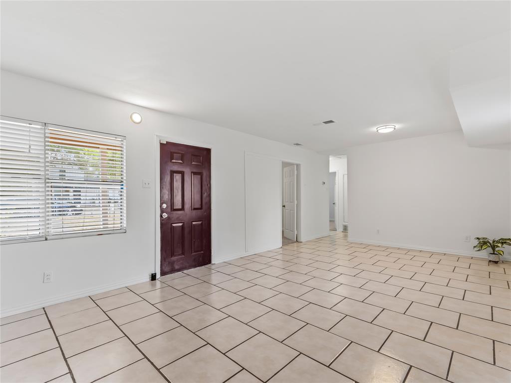 826 Ryan Road Dallas, TX 75224 - Photo 6 of 34 a view of an empty room and window