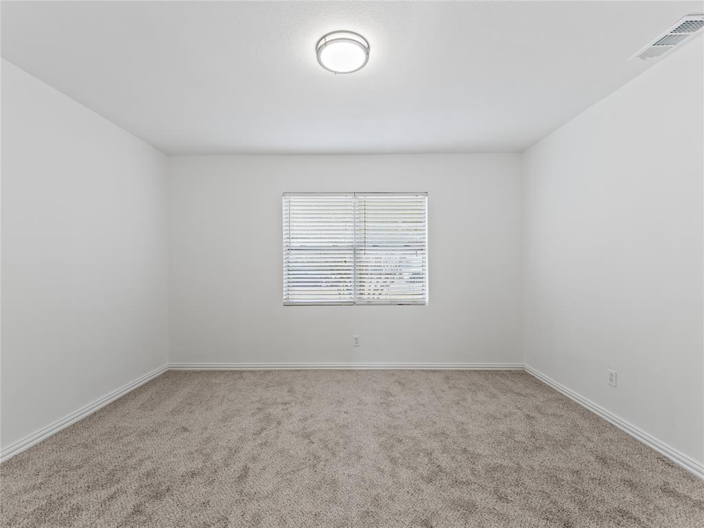 826 Ryan Road Dallas, TX 75224 - Photo 10 of 34 an empty room with a window