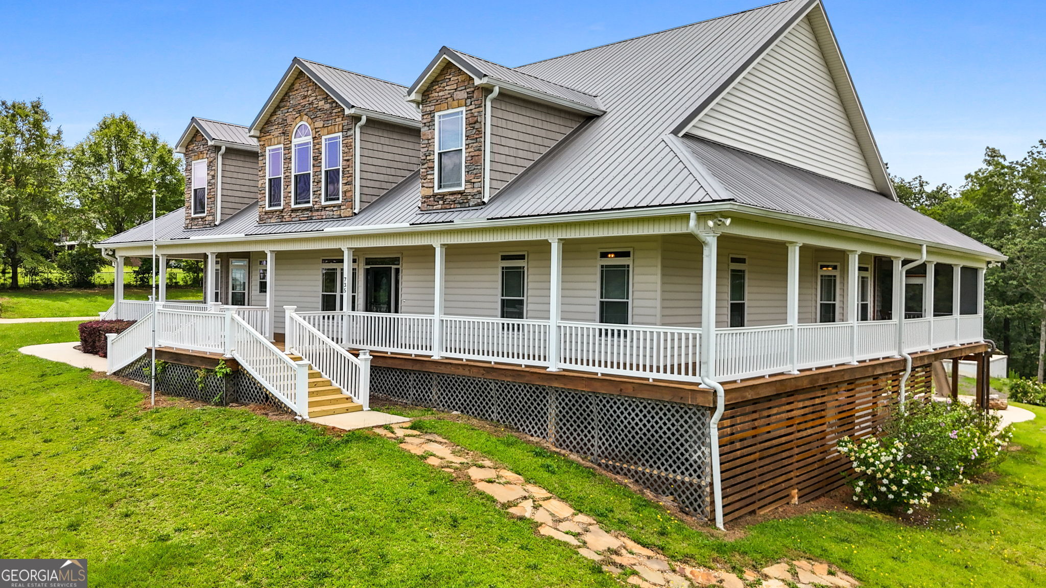 735 Firetower Road Thomaston, GA 30286 - Photo 11 of 112 a front view of a house with a yard table and chairs