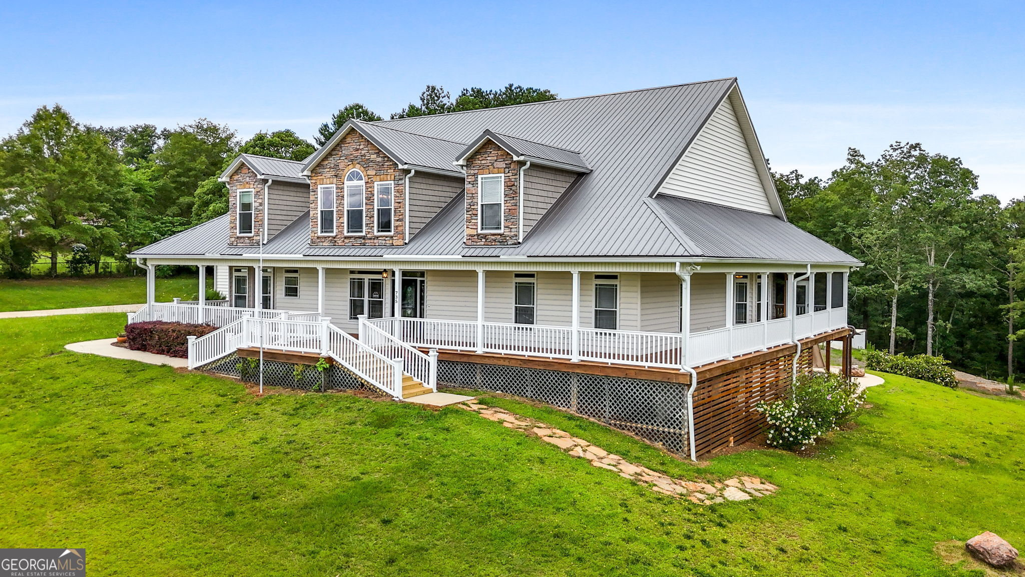 735 Firetower Road Thomaston, GA 30286 - Photo 18 of 112 a front view of a house with a yard table and chairs