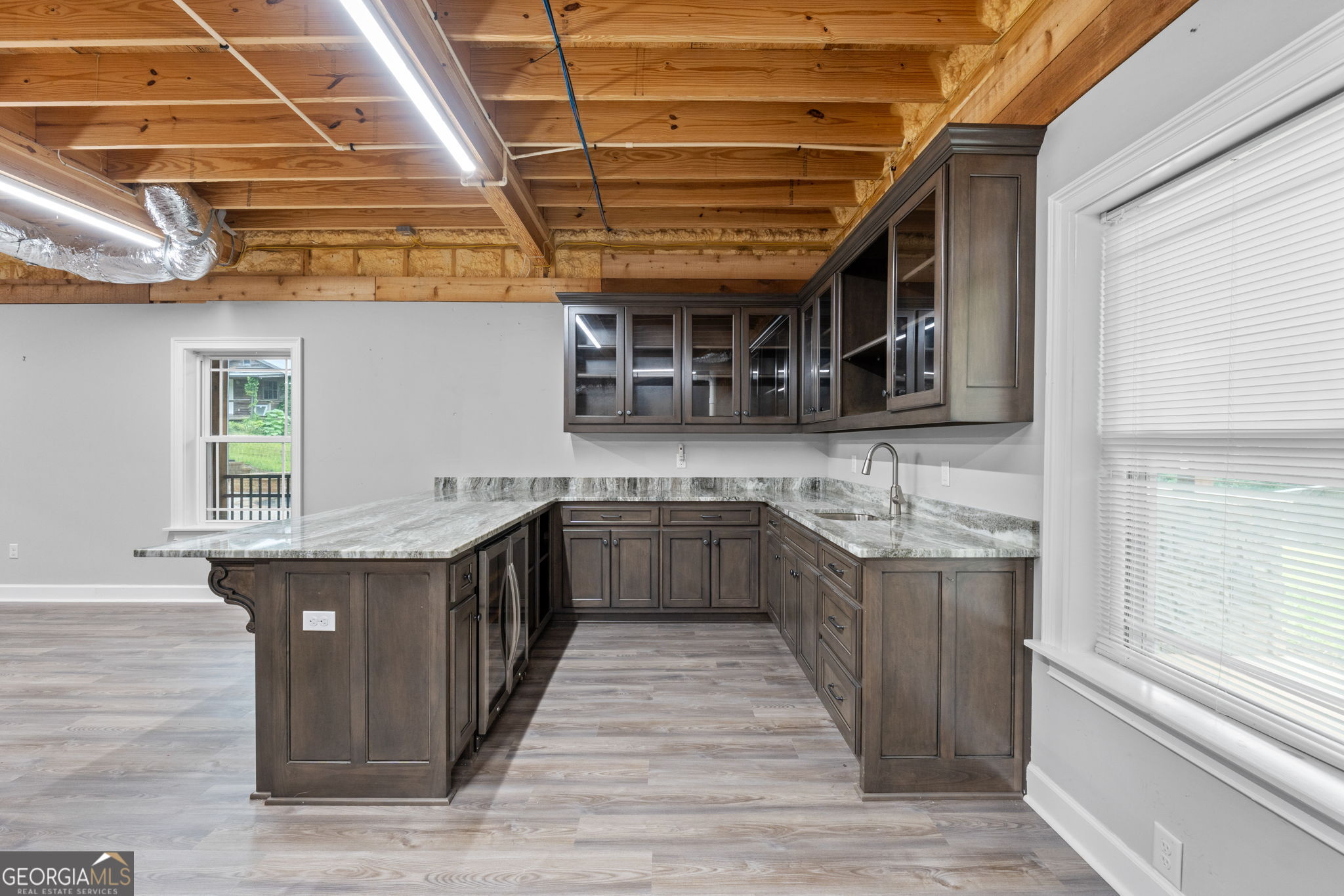 735 Firetower Road Thomaston, GA 30286 - Photo 41 of 112 a kitchen with stainless steel appliances granite countertop a wooden cabinets and counter space