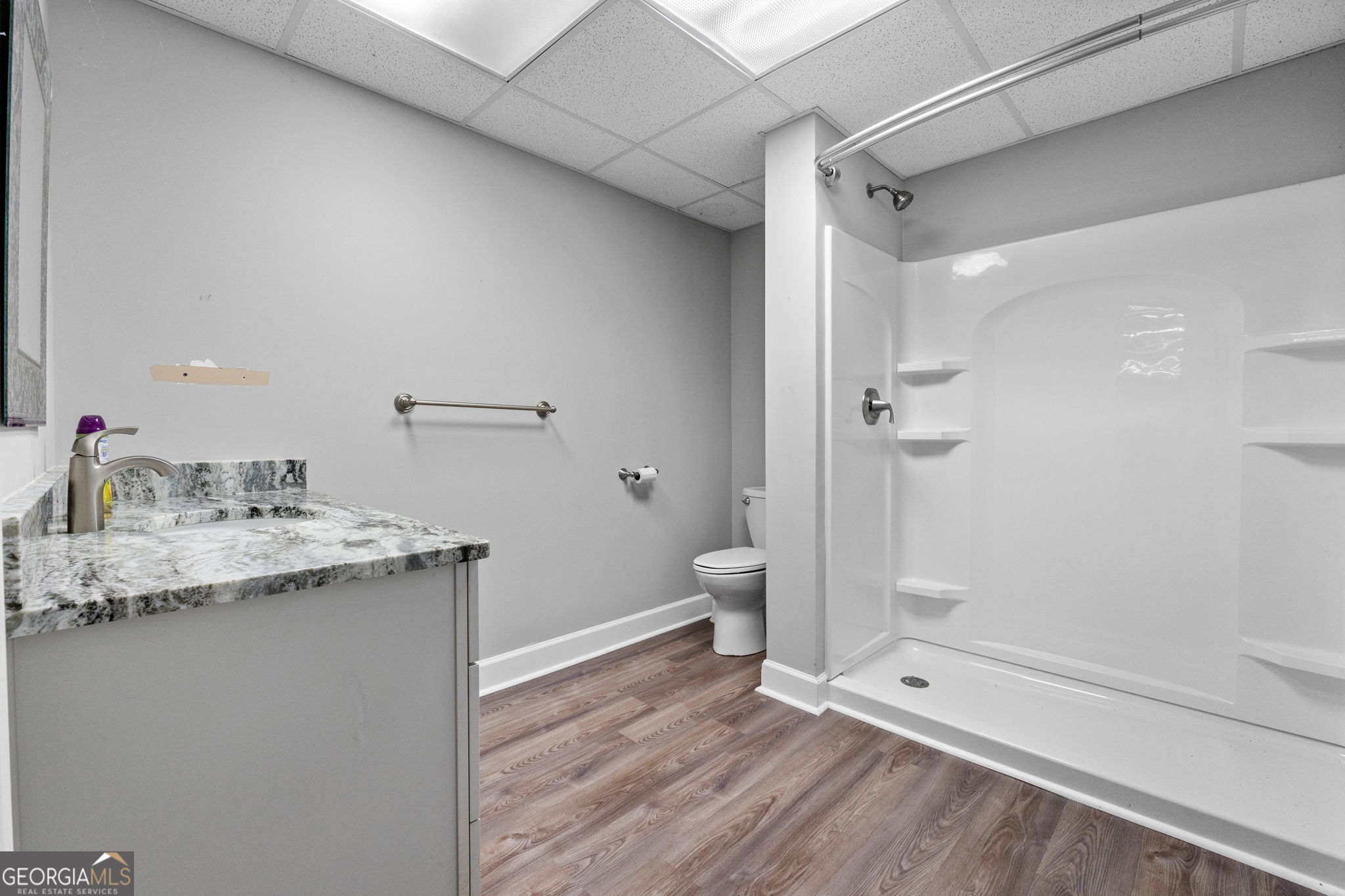 735 Firetower Road Thomaston, GA 30286 - Photo 43 of 112 a bathroom with a granite countertop sink toilet and shower