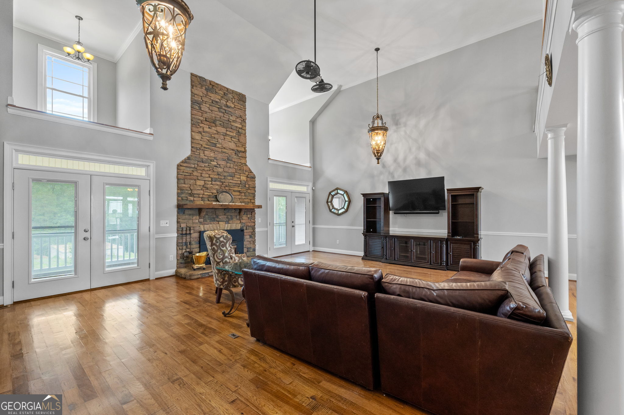 735 Firetower Road Thomaston, GA 30286 - Photo 76 of 112 a living room with furniture a fireplace and a flat screen tv