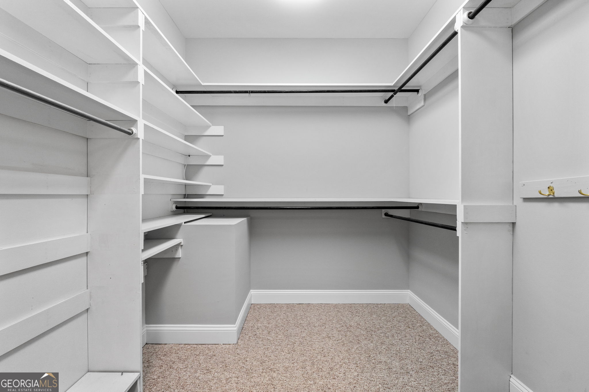 735 Firetower Road Thomaston, GA 30286 - Photo 84 of 112 a view of walk in closet with empty racks