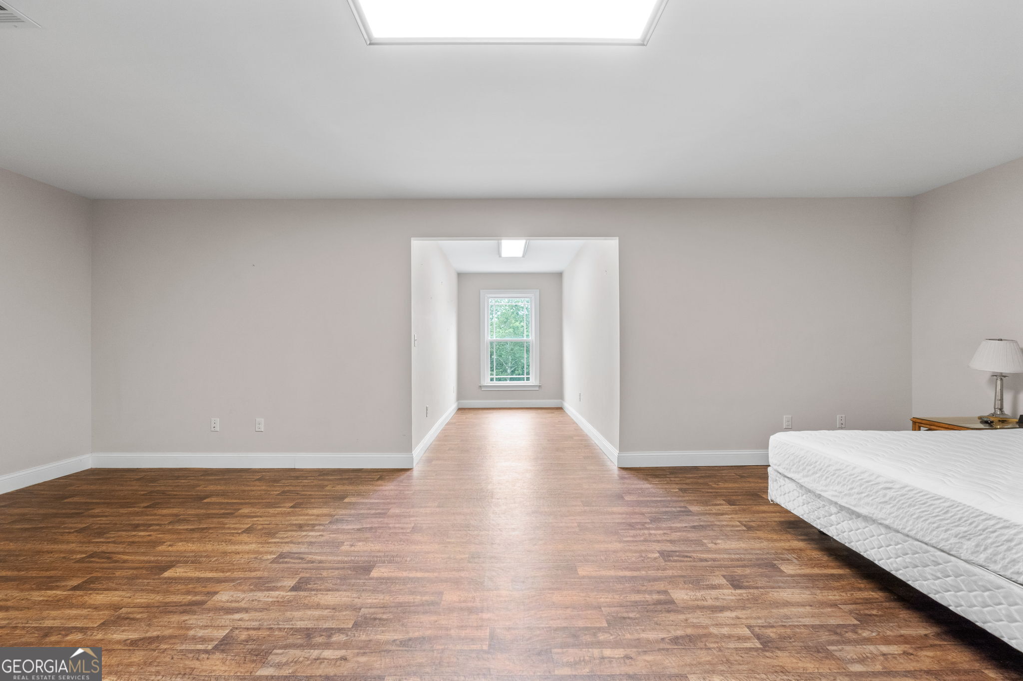 735 Firetower Road Thomaston, GA 30286 - Photo 92 of 112 a view of a bedroom with wooden floor and window