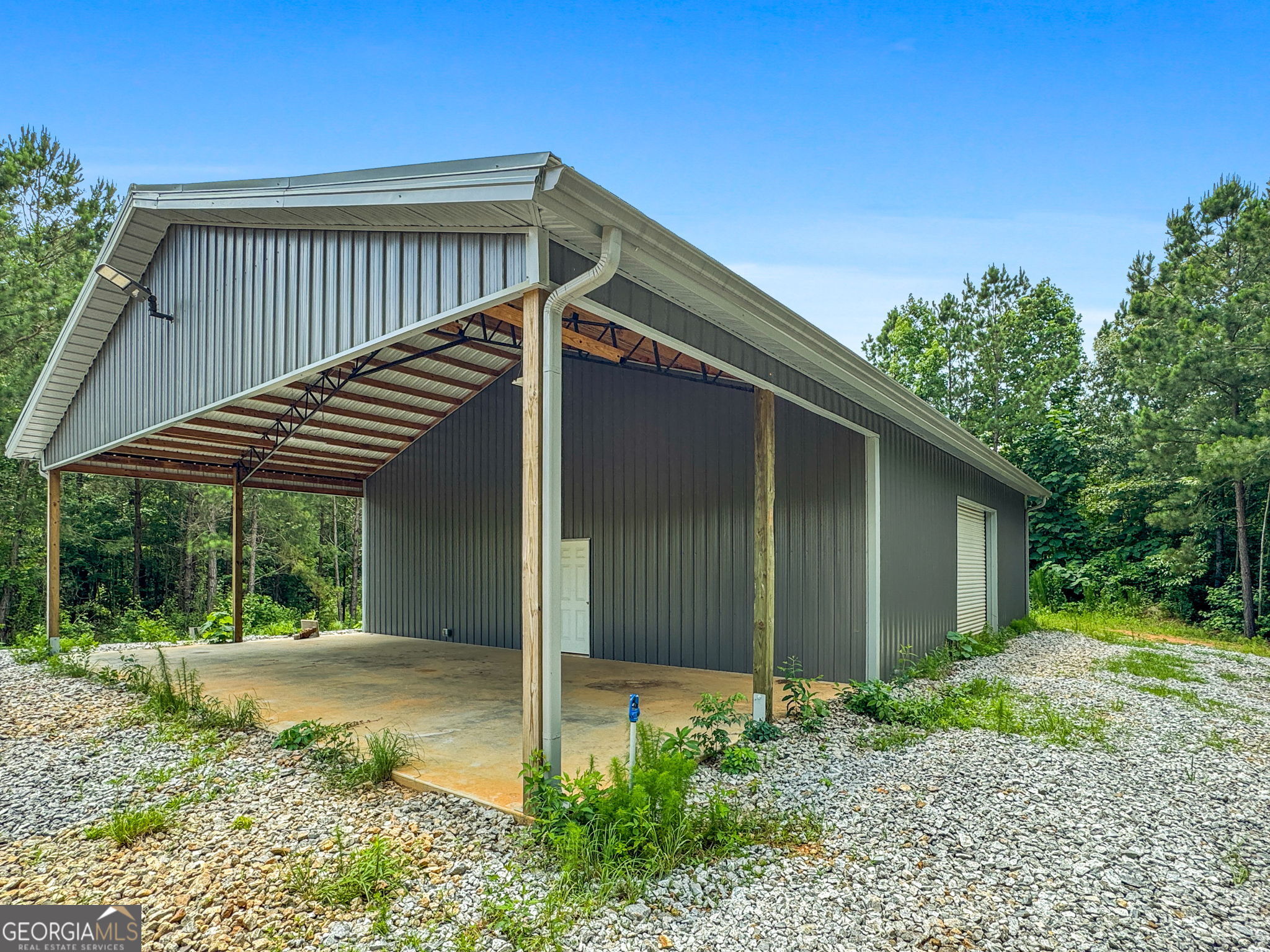 735 Firetower Road Thomaston, GA 30286 - Photo 10 of 112 a view of house with backyard and glass windows