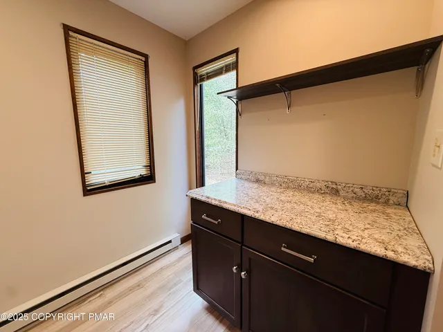 a view of wooden floor and a window