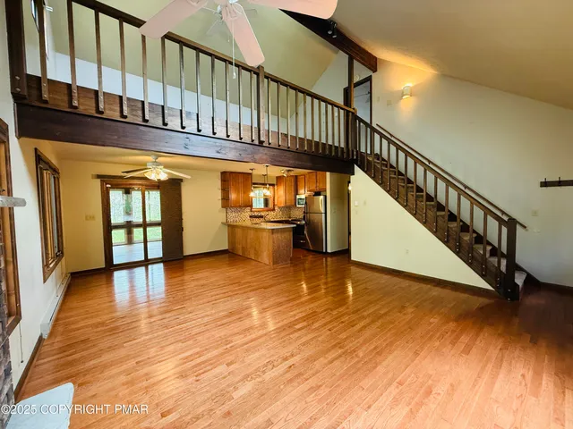 a view of an entryway with wooden floor