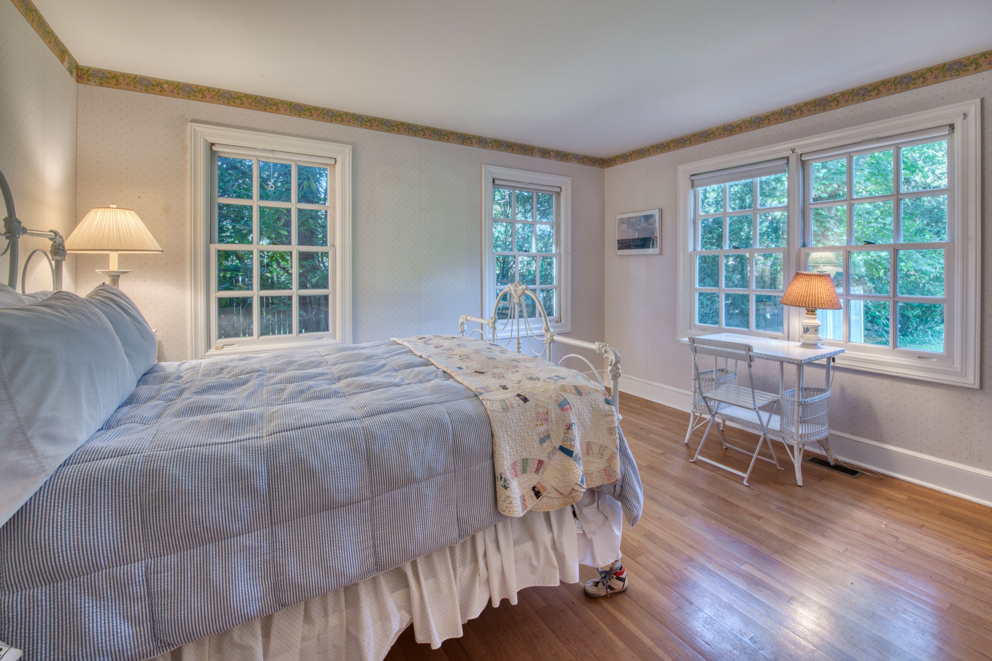 65 Skimhampton Road East Hampton, NY 11937 - Photo 7 of 16 a bedroom with a bed and wooden floor