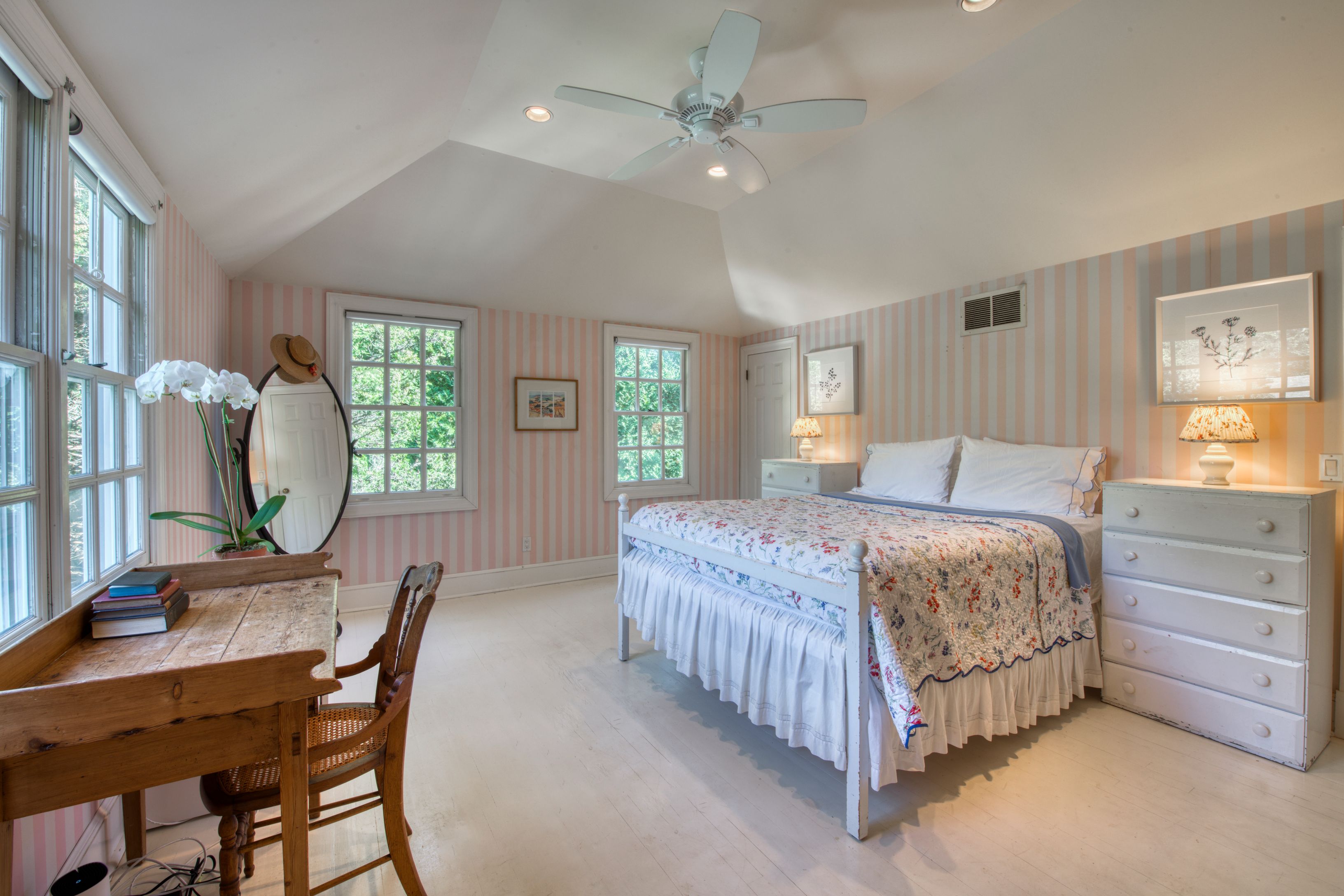 65 Skimhampton Road East Hampton, NY 11937 - Photo 9 of 16 a bedroom with a bed a mirror on dresser and a window
