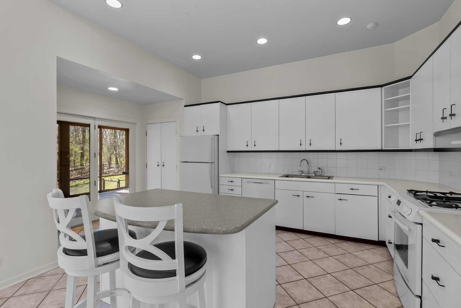 3610 Paulson Road Harvard, IL 60033 - Photo 8 of 30 a kitchen with a stove a sink a microwave and cabinets