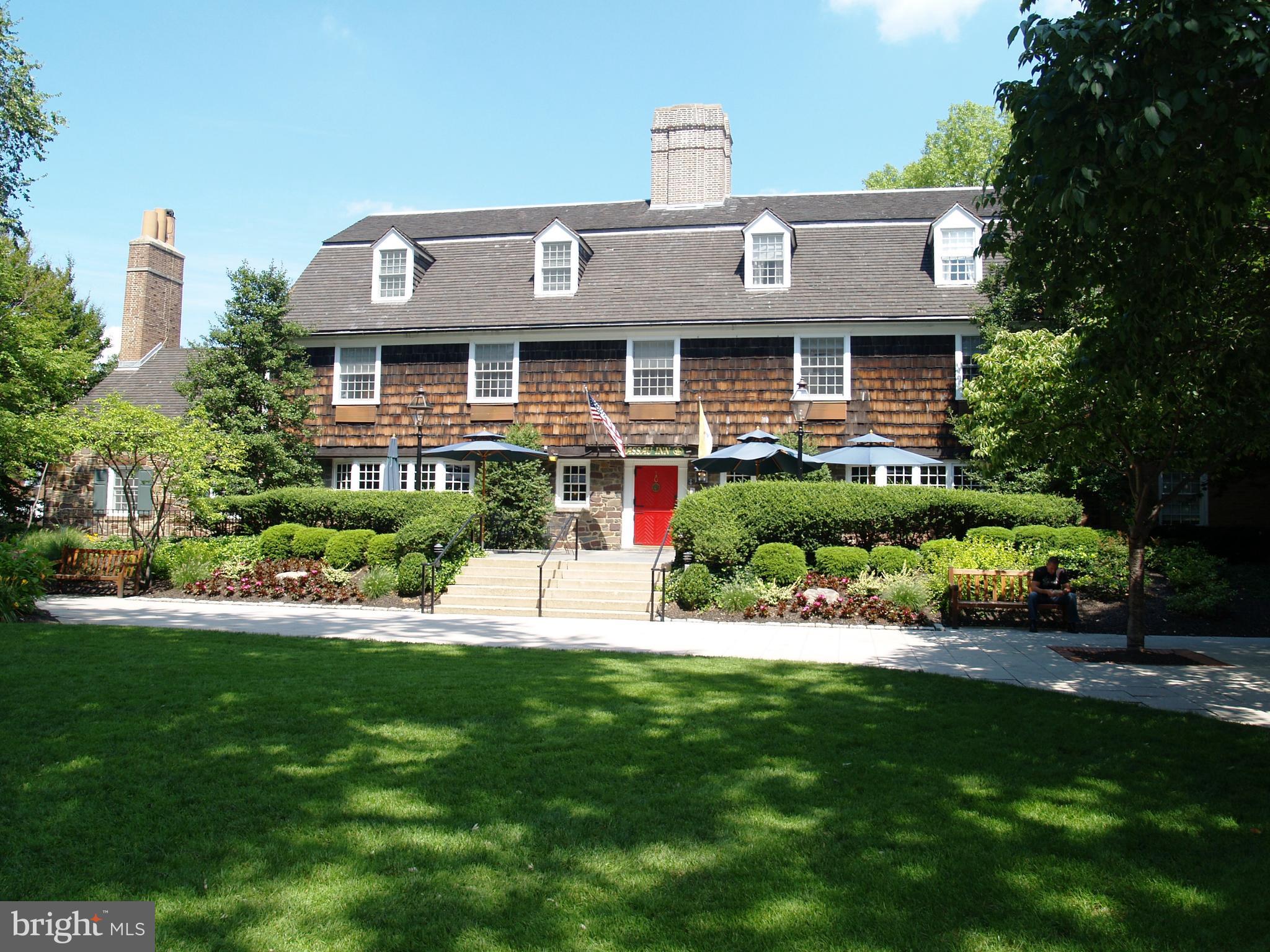 45 Spring Street, Unit 2 Princeton, NJ 08542 - Photo 16 of 22 a view of a house with a big yard potted plants and large trees