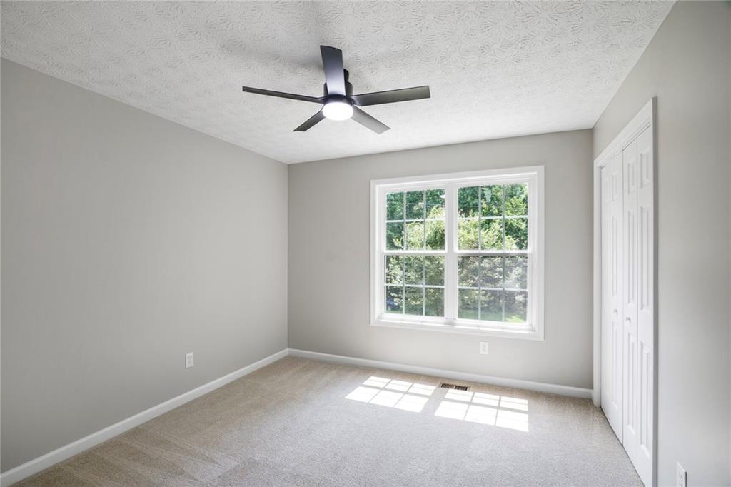 232 Barrett Springs Way Canton, GA 30115 - Photo 19 of 29 a view of an empty room with a window