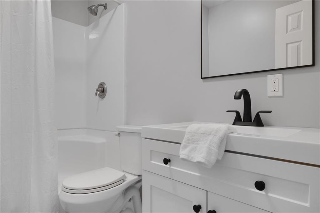 232 Barrett Springs Way Canton, GA 30115 - Photo 22 of 29 a bathroom with a sink and a toilet