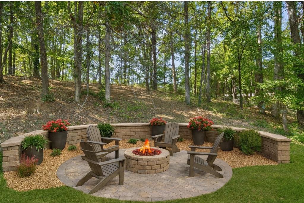 232 Barrett Springs Way Canton, GA 30115 - Photo 28 of 29 a backyard of a house with yard and outdoor seating