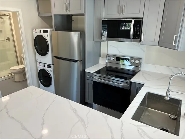 a kitchen with a stove and a microwave