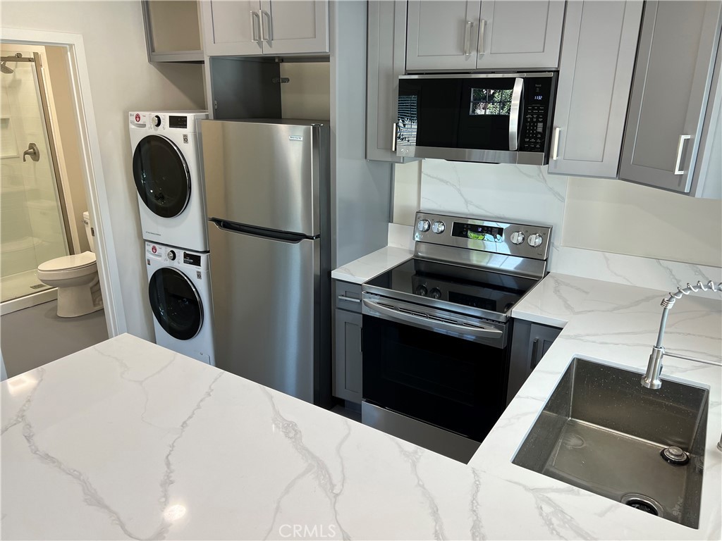 2290 Cogswell Road, Unit B El Monte, CA 91732 - Photo 6 of 12 a kitchen with a stove and a microwave