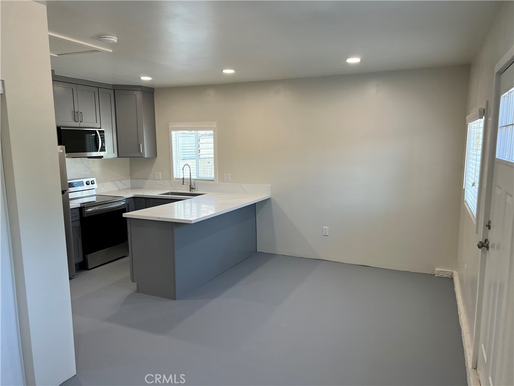2290 Cogswell Road, Unit B El Monte, CA 91732 - Photo 10 of 12 view of kitchen with sink microwave and cabinets