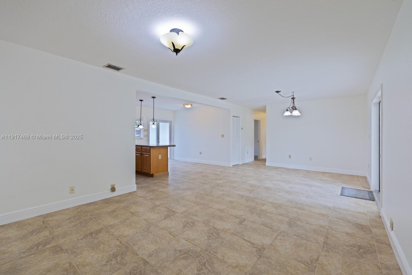 524 Northwest 14th Street Homestead, FL 33030 - Photo 14 of 37 an empty room with a empty space and windows