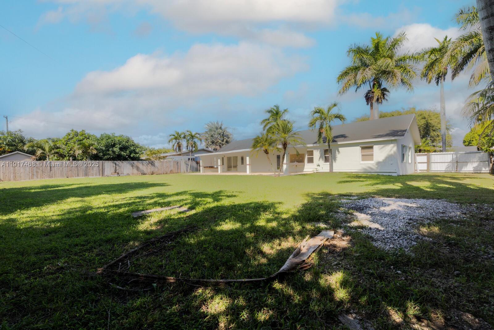 524 Northwest 14th Street Homestead, FL 33030 - Photo 15 of 37 a view of a house with a big yard