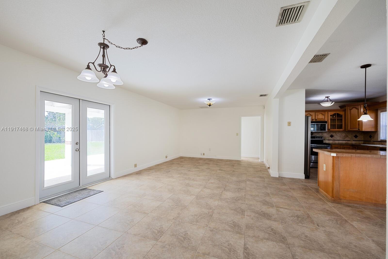 524 Northwest 14th Street Homestead, FL 33030 - Photo 16 of 37 a view of a kitchen with a sink and a refrigerator