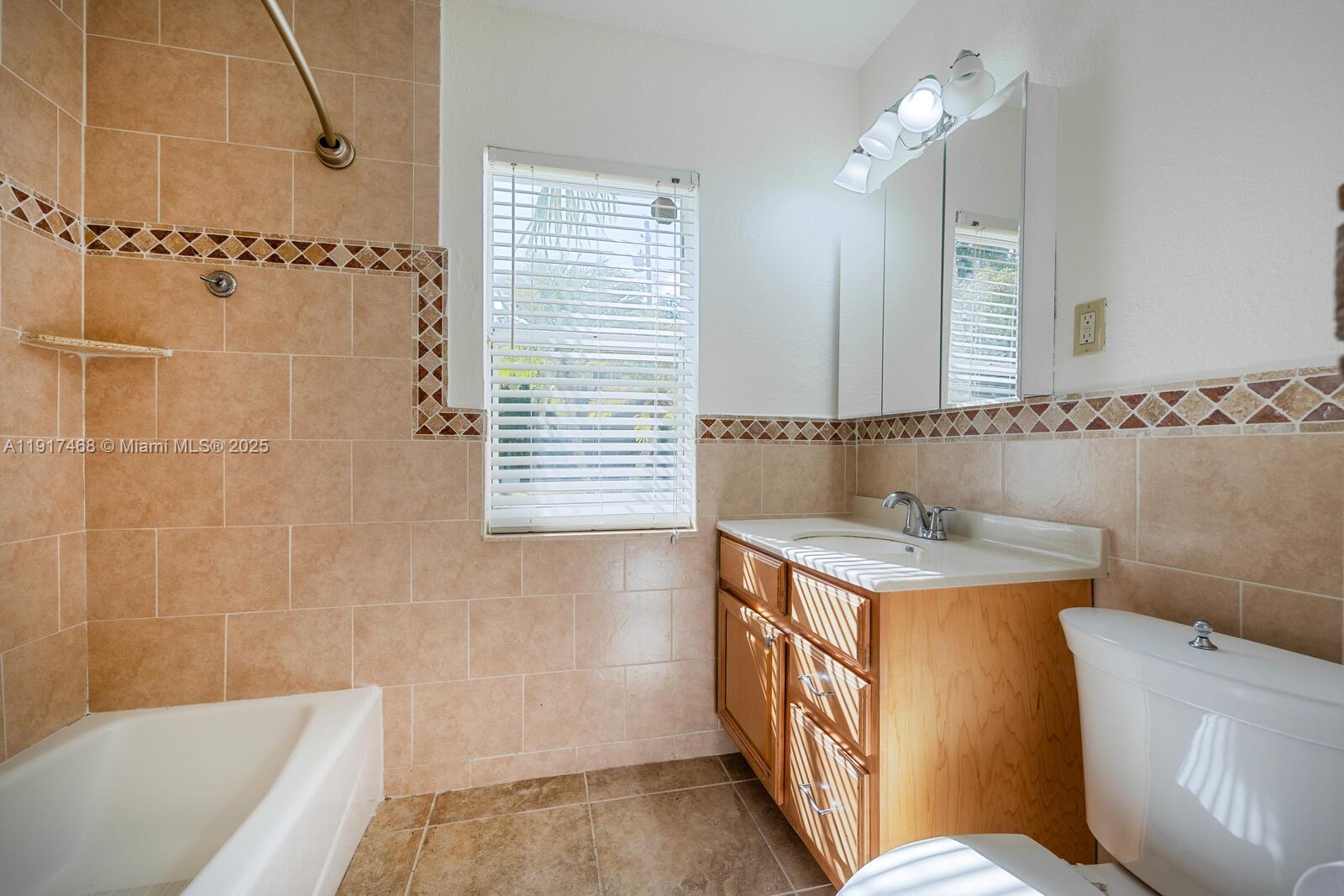 524 Northwest 14th Street Homestead, FL 33030 - Photo 17 of 37 a bathroom with a sink a toilet and shower