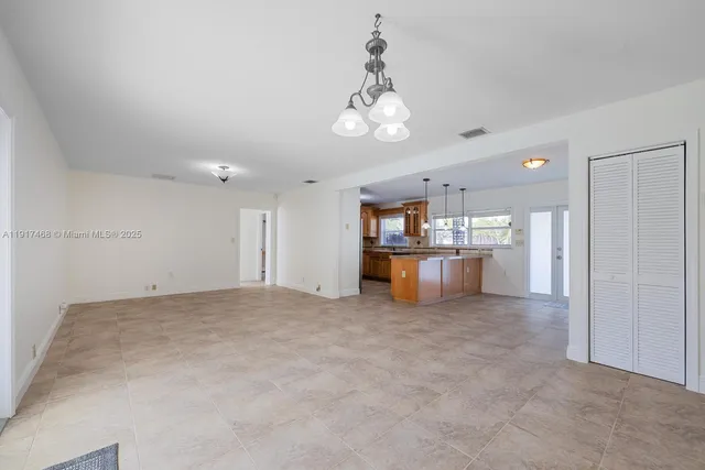 a view of a kitchen with a sink and cabinets