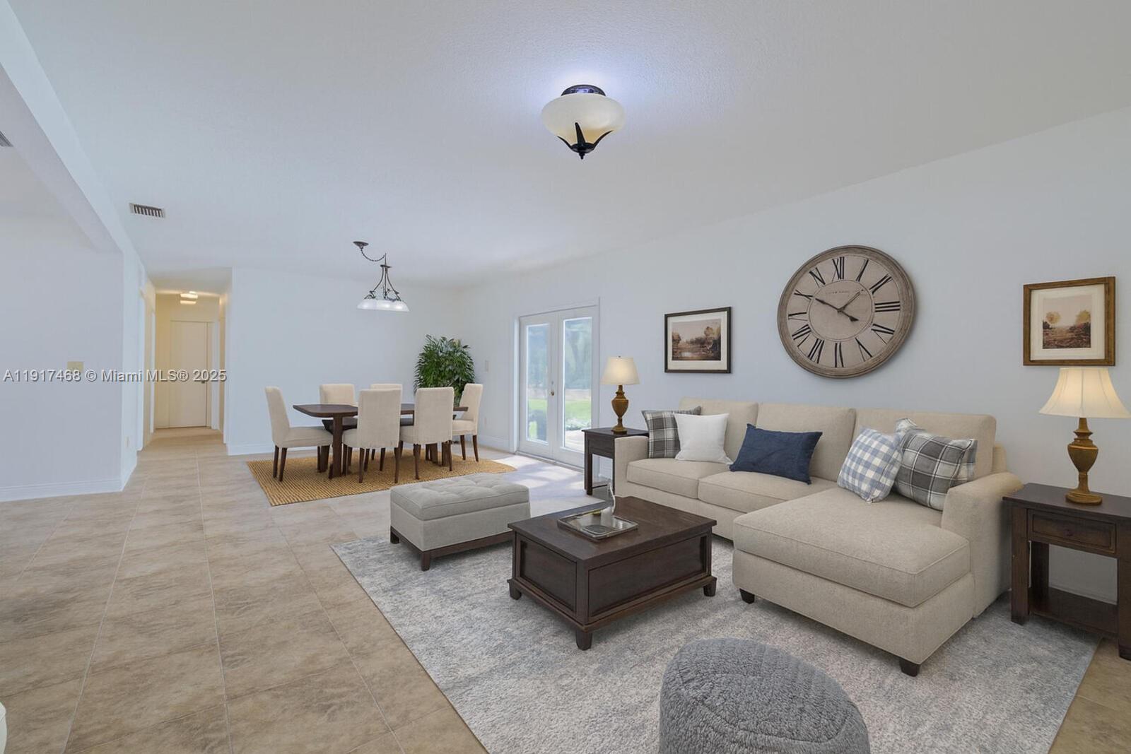 524 Northwest 14th Street Homestead, FL 33030 - Photo 2 of 37 a living room with furniture and a large window