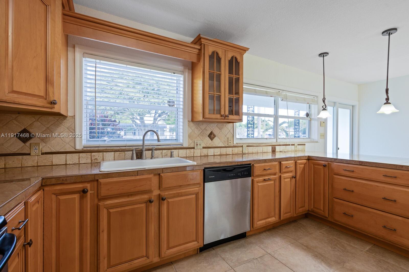 524 Northwest 14th Street Homestead, FL 33030 - Photo 24 of 37 a kitchen with sink and window