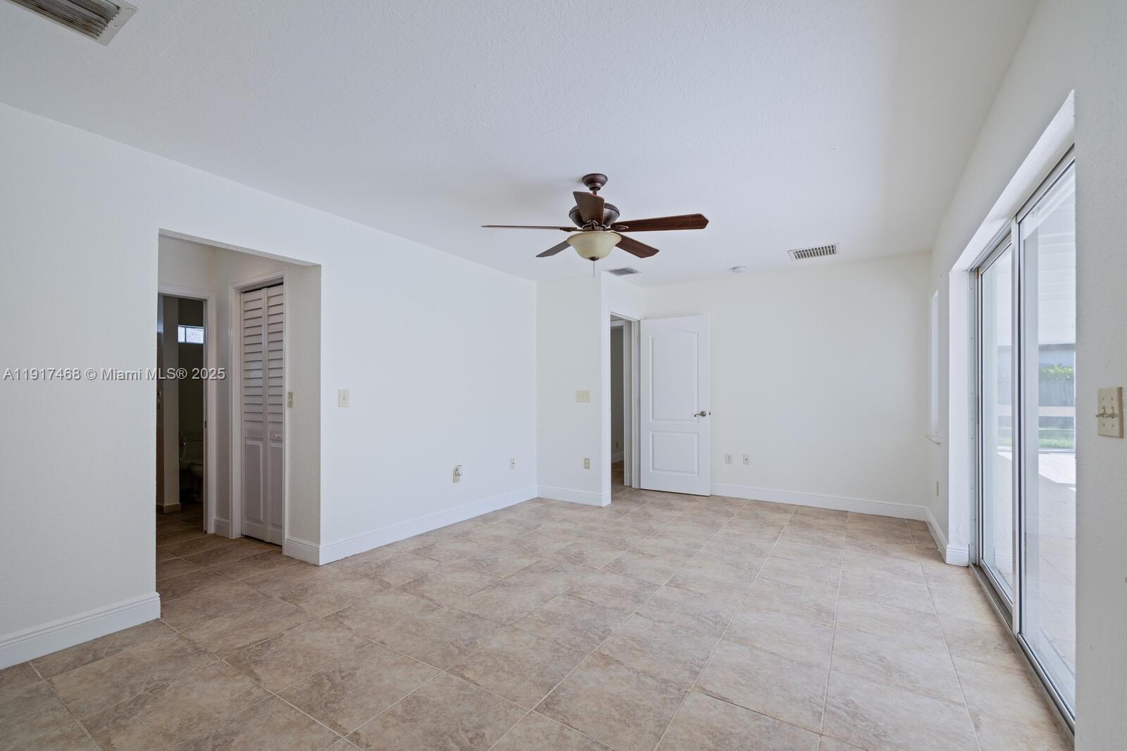 524 Northwest 14th Street Homestead, FL 33030 - Photo 25 of 37 a view of empty room with a ceiling fan