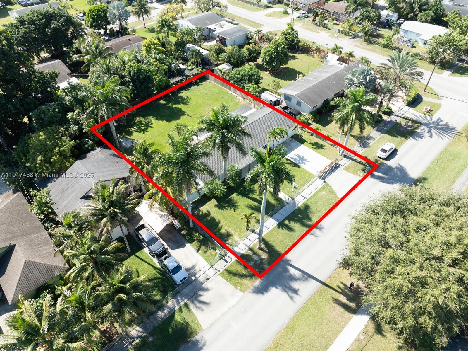 524 Northwest 14th Street Homestead, FL 33030 - Photo 28 of 37 an aerial view of a tennis ground and a large tree