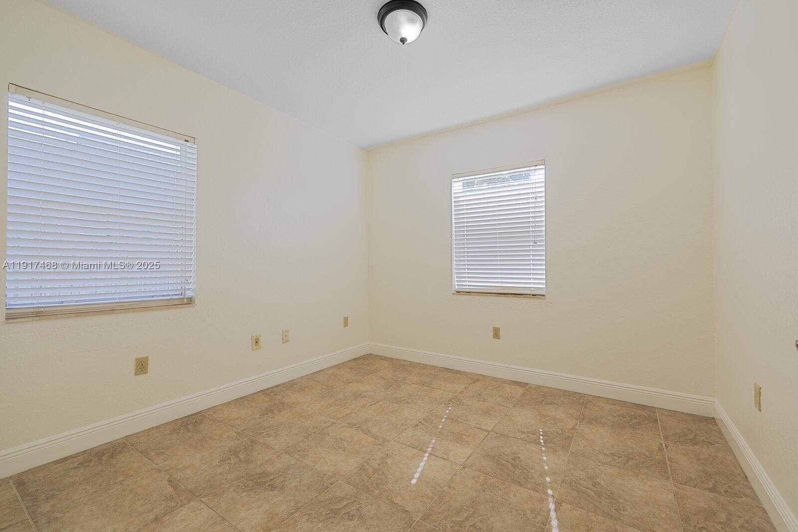 524 Northwest 14th Street Homestead, FL 33030 - Photo 29 of 37 an empty room with a window