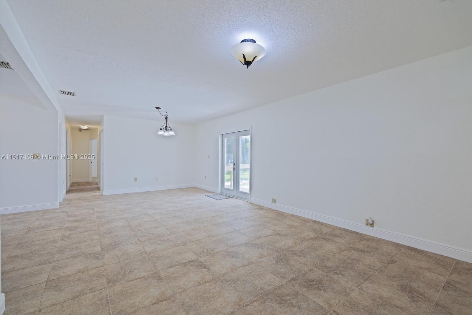 524 Northwest 14th Street Homestead, FL 33030 - Photo 10 of 37 a view of an empty room with a window