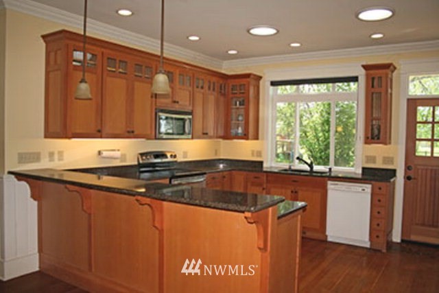 337 Mission Road Walla Walla, WA 99362 - Photo 4 of 23 a kitchen with stainless steel appliances granite countertop a sink a stove and a refrigerator