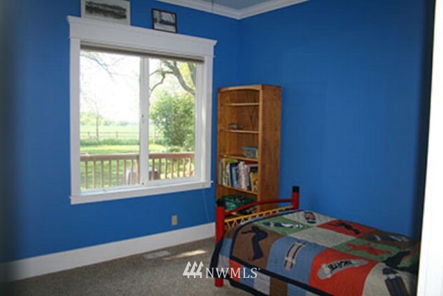 337 Mission Road Walla Walla, WA 99362 - Photo 9 of 23 a bed sitting in a bedroom next to a window