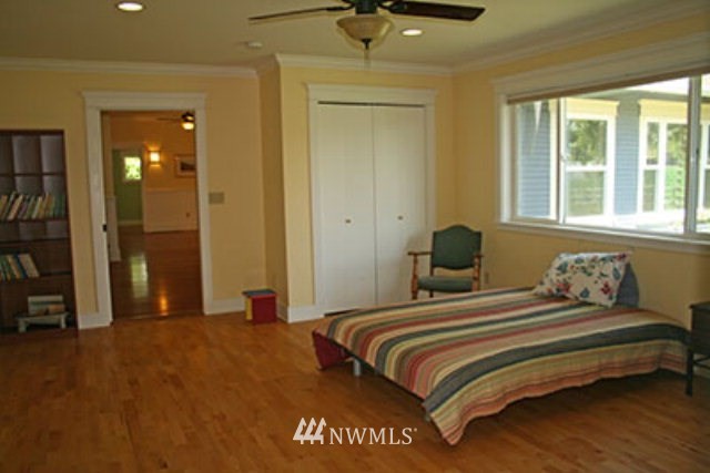 337 Mission Road Walla Walla, WA 99362 - Photo 10 of 23 a bedroom with a bed and a chandelier