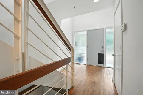 a spacious bathroom with a double vanity sink a mirror and a bathtub