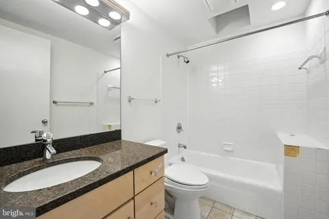 a view of a bathroom with a tub and toilet