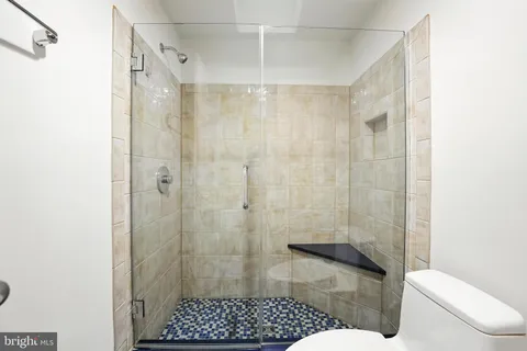 a view of a two chairs and table in the balcony