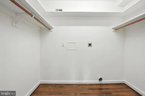 a view of a house with a tree in the background