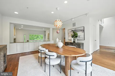 a kitchen with granite countertop a stove and a sink