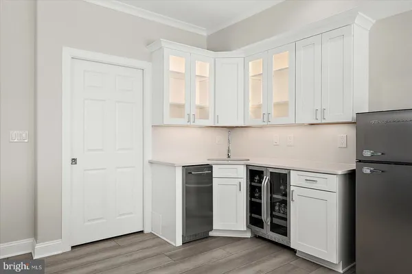 a living room with furniture and large windows