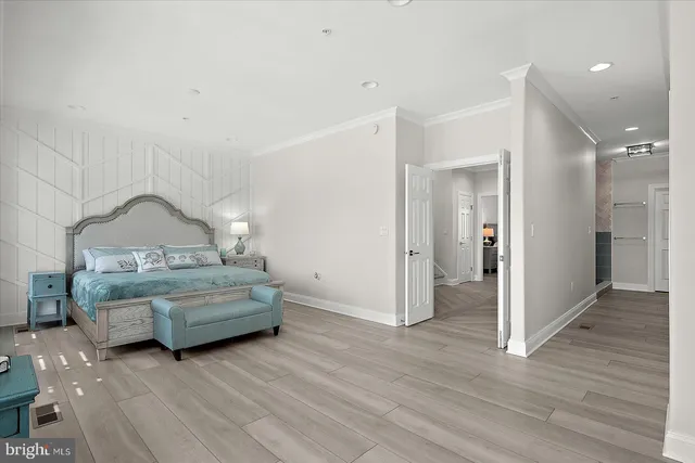 a view of a room that has a table and chairs in it